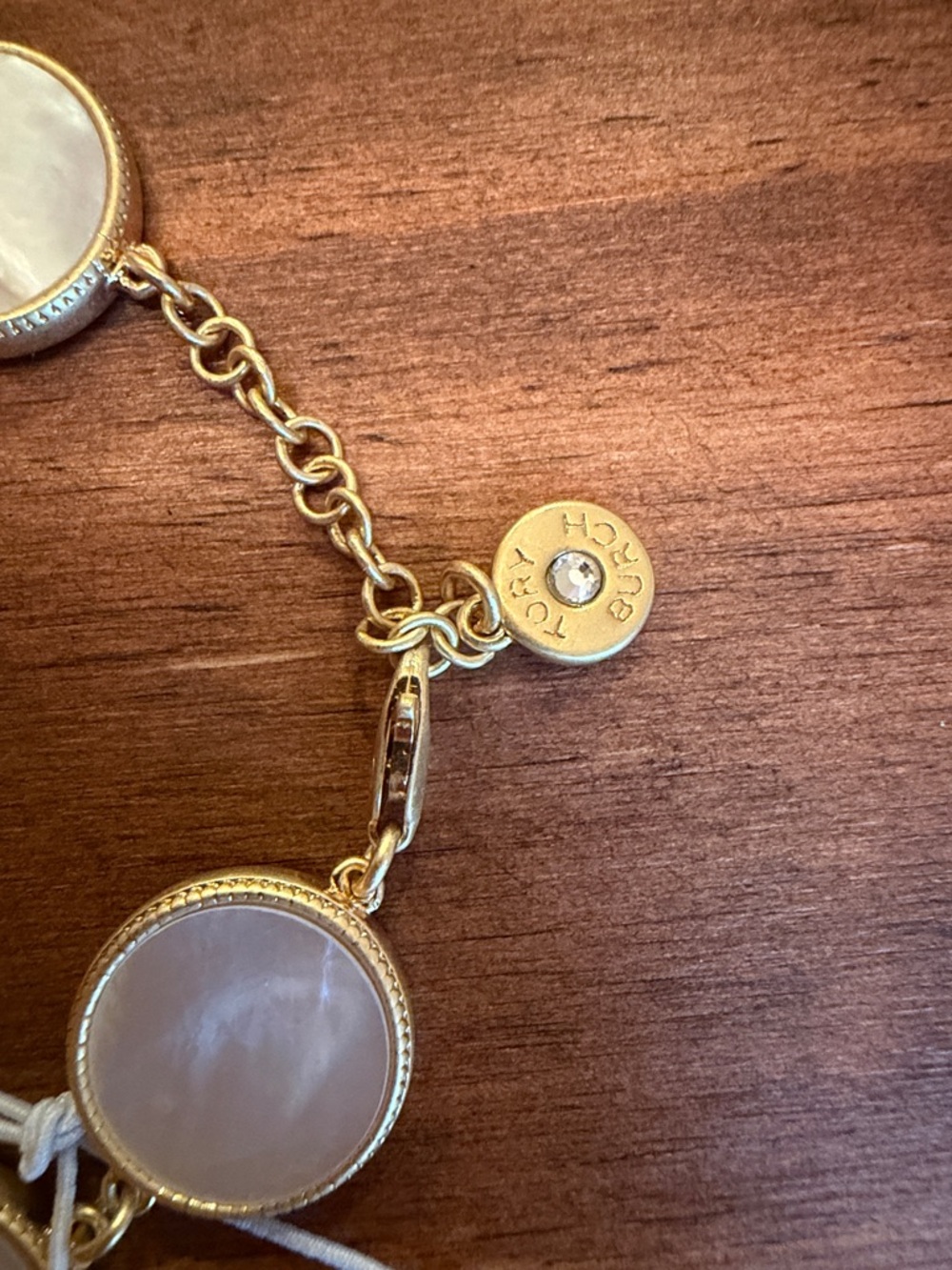 Tory Burch Gold Tone Mother-of-Pearl Round Link Bracelet - Picture 2 of 4